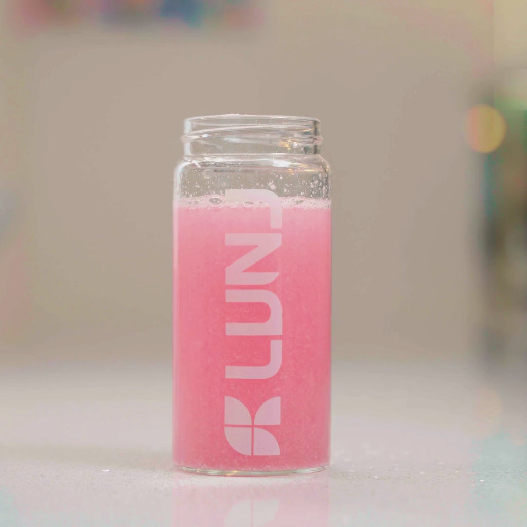 LUNJ FitGlo collagen creatine electrolyte sachet being stirred